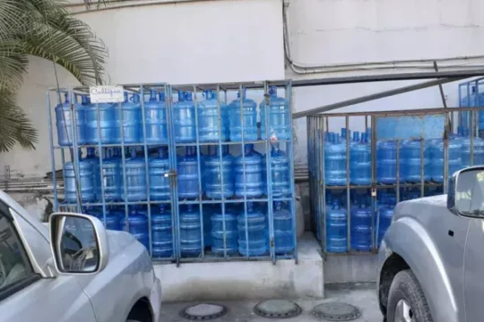 gallons-of-water-stored-in-the-sun,-a-health-hazard-in-haiti